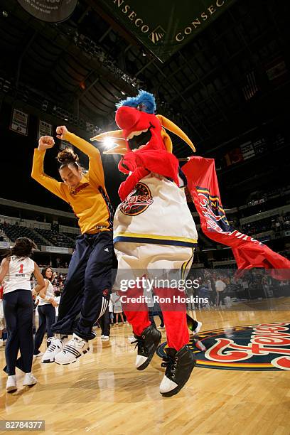 Tully Bevilaqua of the Indiana Fever has some fun with Freddie Fever, the Fever mascot, during player introductions as the Fever took on the New York...