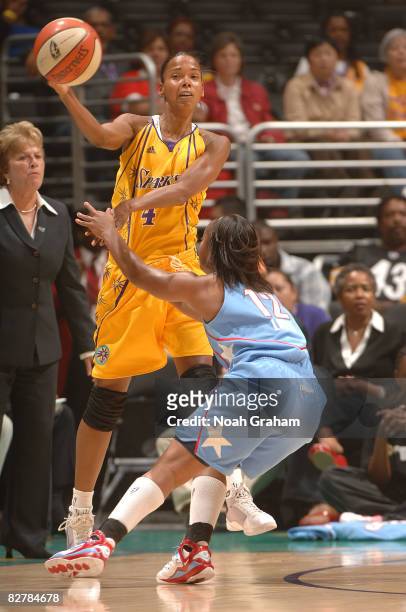 Kiesha Brown of the Los Angeles Sparks passes the ball over Ivory Latta of the Atlanta Dream on September 11, 2008 at Staples Center in Los Angeles,...