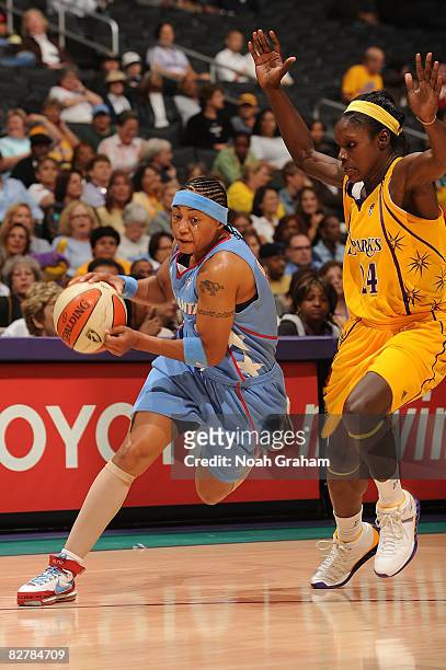 Betty Lennox of the Atlanta Dream drives to the basket against Marie Ferdinand-Harris of the Los Angeles Sparks on September 11, 2008 at Staples...