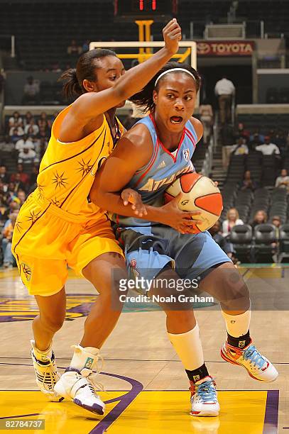 Ivory Latta of the Atlanta Dream drives on Shannon Bobbitt of the Los Angeles Sparks on September 11, 2008 at Staples Center in Los Angeles,...