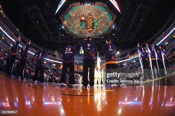 Members of the Los Angeles Sparks stand together during the National Anthem before a game against the Atlanta Dream on September 11, 2008 at Staples...