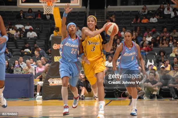 Candace Parker of the Los Angeles Sparks makes a pass against the defense of Betty Lennox of the Atlanta Dream on September 11, 2008 at Staples...