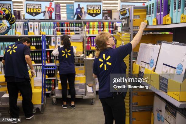 Employees restock shelves of school supplies at a Wal-Mart Stores Inc. Location in Burbank, California, U.S., on Tuesday, Aug. 8, 2017. Wal-Mart...