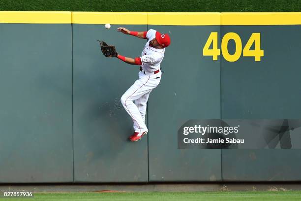 Billy Hamilton of the Cincinnati Reds makes a catch off the center field wall in the third inning against the San Diego Padres at Great American Ball...