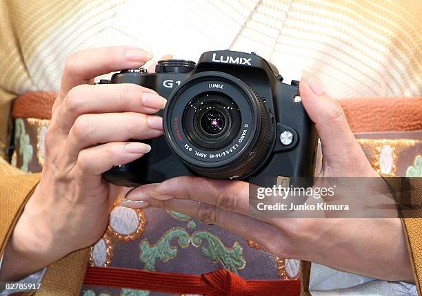 Matsushita Electric Industrial Co., Ltd's world's smallest new single-lens reflex camera Lumix G1 is on display during a press conference at Izumi...