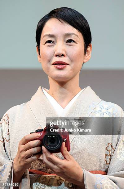 Japanese actresses Kanako Higuchi introduces Matsushita Electric Industrial Co., Ltd's world's smallest new single-lens reflex camera Lumix G1 during...