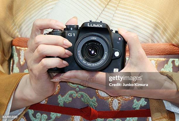 Matsushita Electric Industrial Co., Ltd's world's smallest new single-lens reflex camera Lumix G1 is on display during a press conference at Izumi...