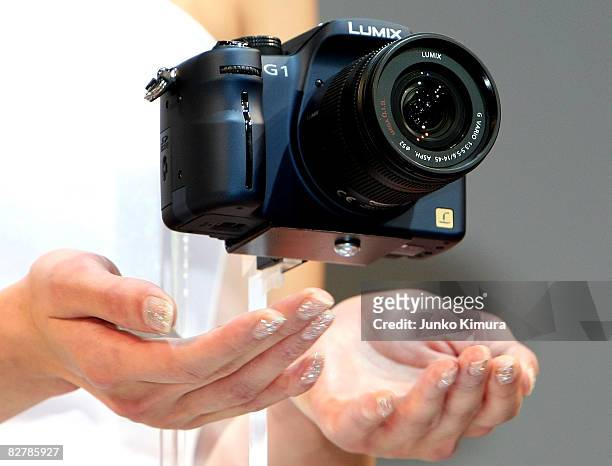 Matsushita Electric Industrial Co., Ltd's world's smallest new single-lens reflex camera Lumix G1 is on display during a press conference at Izumi...