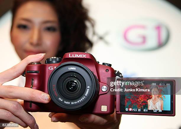 Matsushita Electric Industrial Co., Ltd's world's smallest new single-lens reflex camera Lumix G1 is on display during a press conference at Izumi...