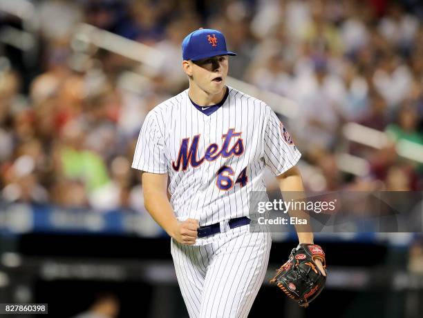 Chris Flexen of the New York Mets celebrates the final out of the fourth inning against the Texas Rangers during interleague play on August 8, 2017...