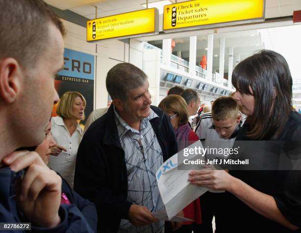 Airlines passengers wait for information after being left stranded at Glasgow Airport due to the collapse of the holiday firm which led to the...