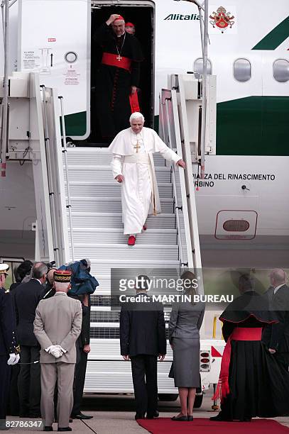 Pope Benedict XVI is welcomed by French President Nicolas Sarkozy and his wife Carla Bruni-Sarkozy upon arrival at Orly airport, south of Paris, on...