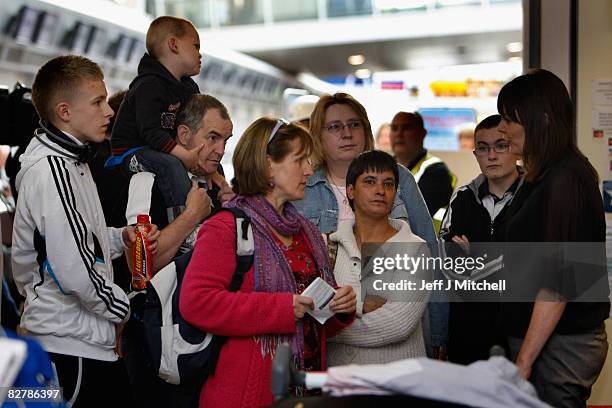 Airlines passengers wait for information after being left stranded at Glasgow Airport due to the collapse of the holiday firm which led to the...