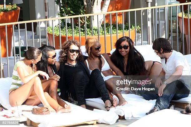 Russell Brand relaxes beside a swimming pool after hosting the VMA Awards, September 8 in Los Angeles, California.