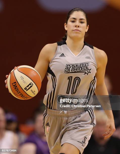 Kelsey Plum of the San Antonio Stars handles the ball during the WNBA game against the Phoenix Mercury at Talking Stick Resort Arena on July 30, 2017...