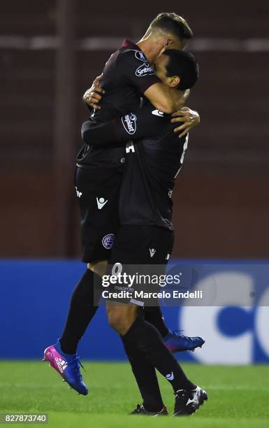 Jose Sand of Lanus celebrates with Nicolas Pasquini of Lanus after scoring the opening goal during the second leg match between Lanus and The...