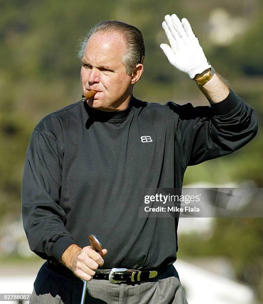 Radio personality Rush Limbaugh waves to the gallery on the 6th green.