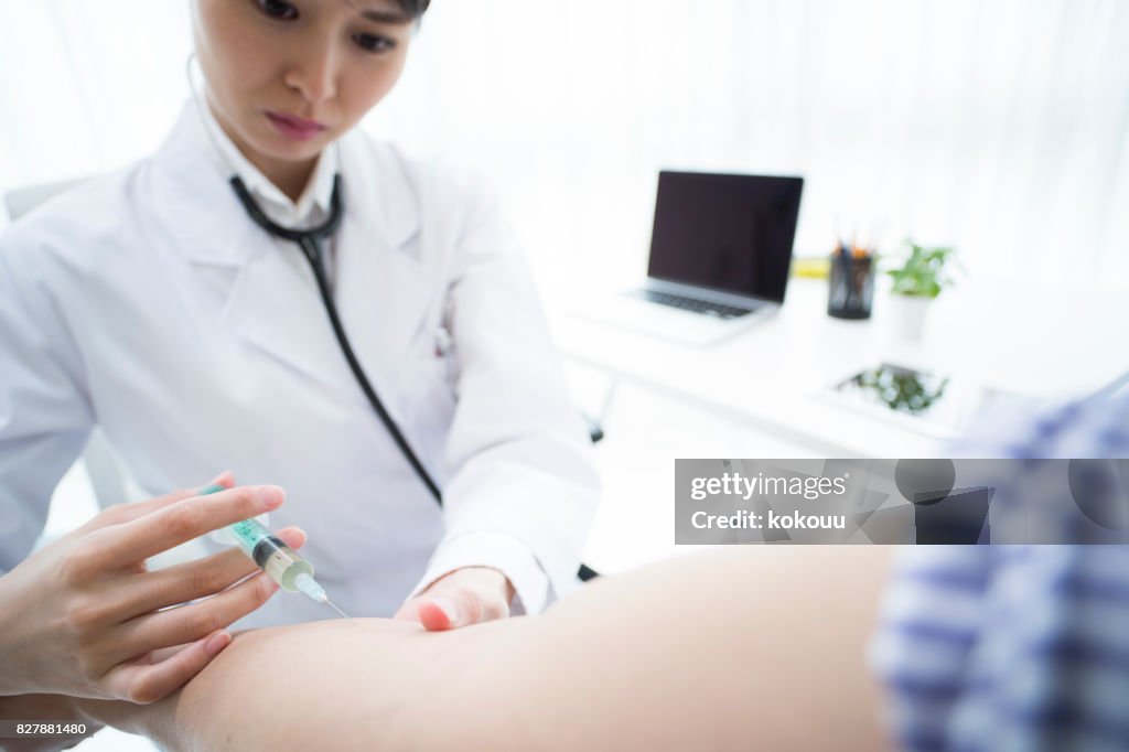 Patient Arm Injection A Female Doctor Is Injecting The Patients Arm High-Res Stock Photo ...