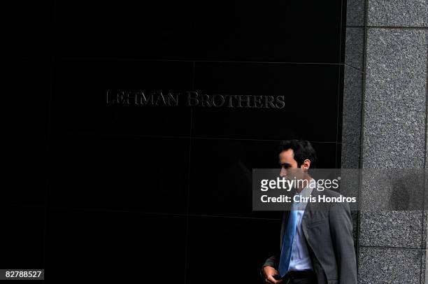 An employee of Lehman Brothers enters the headquarters building of the troubled bank September 12, 2008 in New York. The no. 4 U.S. Investment bank...