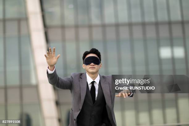 young businessman with eye mask - fato completo imagens e fotografias de stock