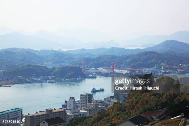 view of castle and shipyard, onomichi, hiroshima, japan - hiroshima castle stock pictures, royalty-free photos & images