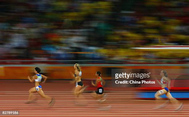 Alexandra Dimoglou of Greece, Tetiana Smyrnova of Ukraine, Sanaa Benhama of Morocco and Nantenin Keita of France compete in the Women's 400m - T13...