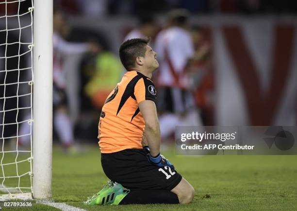 Paraguay's Guarani goalkeeper Alfredo Aguilar reacts after being scored by Argentina's River Plate forward Lucas Alario during their Copa...