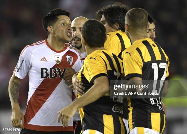 Argentina's River Plate midfielder Enzo Perez argues with Paraguay's Guarani footballers during their Copa Libertadores 2017 round before the...