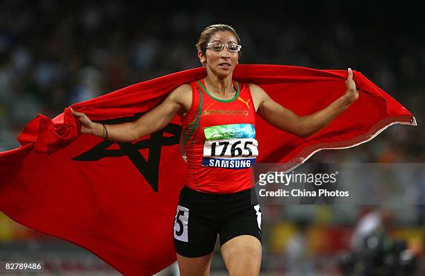 Sanaa Benhama of Morocco celebrates after winning the Women's 400m - T13 Final Athletics event at the National Stadium during day six of the 2008...