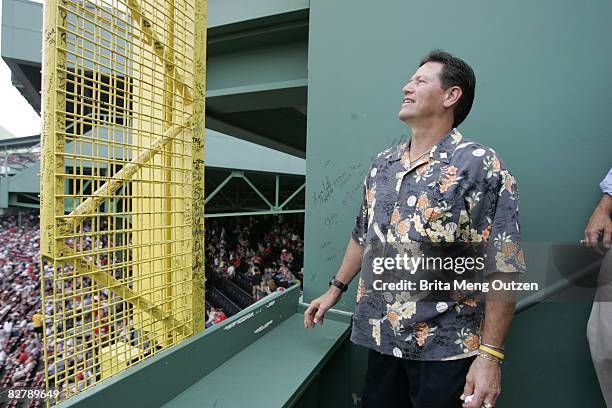 Former Boston Red Sox Carlton Fisk looks at the foul pole atop the Green Monster in left field at Fenway Park in Boston Monday, June 13, 2005. The...