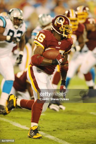 Running back Clinton Portis of the Washington Redskins runs with the ball during the NFL preseason game against the Carolina Panthers at Bank of...