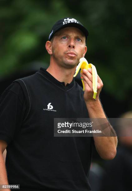 Soren Hansen of Denmark eats a banana on the 10th hole during the second round of The Mercedes-Benz Championship at The Gut Larchenhof Golf Club on...