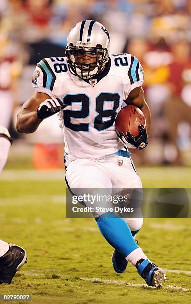 Running back Jonathan Stewart of the Carolina Panthers runs with the football during the NFL preseason game against the Washington Redskins at Bank...