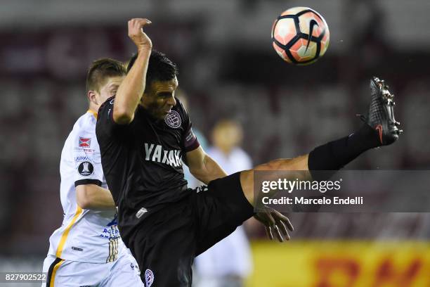 Maximiliano Velazquez of Lanus kicks the ball during the second leg match between Lanus and The Strongest as part of round of 16 of Copa CONMEBOL...