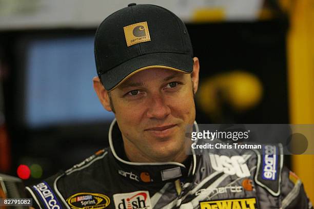 Matt Kenseth, driver of the Carhartt/DeWalt Ford stands in the garage during practice for the NASCAR Sprint Cup Series Sylvania 300 at New Hampshire...