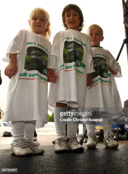 Young children wearing shirts of a campaign "Tought against yourself - fair-play to your enemy" of the German Football association pose before the...