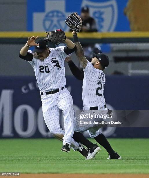 Tyler Saladino of and Leury Garcia of the Chicago White Sox collide after Saladino made a catch of a pop-up in the 6th inning against the Houston...