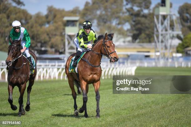 Georgina Cartwright returns to the mounting yard on Altro Mondo after winning the Geelong Homes Maiden Plate, at Geelong Racecourse on August 09,...