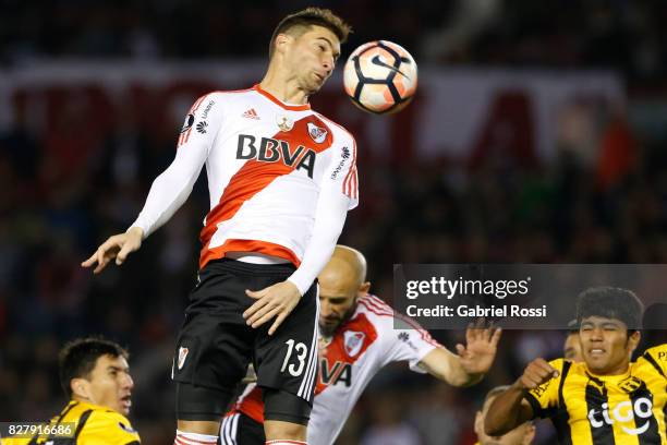 Lucas Alario of River Plate heads the ball during a second leg match between River Plate and Guarani as part of round of 16 of Copa CONMEBOL...