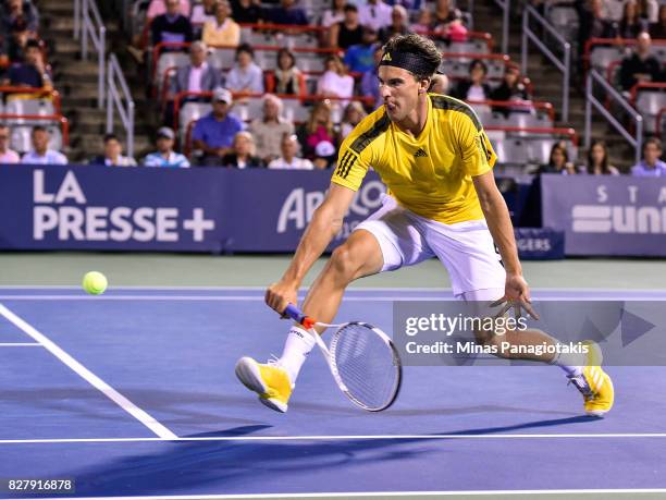 Dominic Thiem of Austria hits a return shot against Diego Schwartzman of Argentina during day five of the Rogers Cup presented by National Bank at...