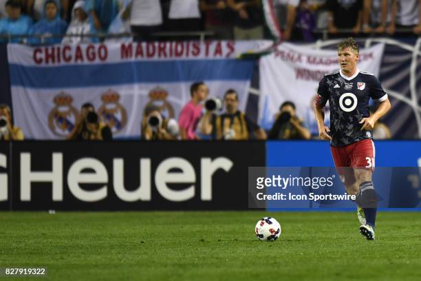 All-Star and Chicago Fire Midfielder Bastian Schweinsteiger controls the ball in the first half during a soccer match between the MLS All-Stars and...