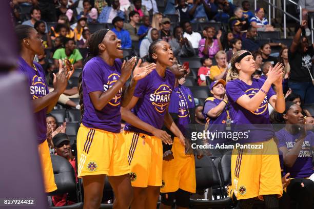 Tiffany Jackson-Jones, Sandrine Gruda and Sydney Wiese of the Los Angeles Sparks react to a play against the New York Liberty on August 4, 2017 at...