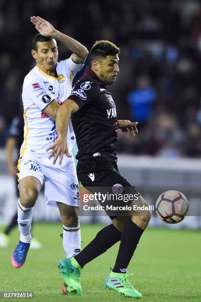 Diego Braghieri of Lanus fights for ball with Raul Castro of The Strongest during the second leg match between Lanus and The Strongest as part of...