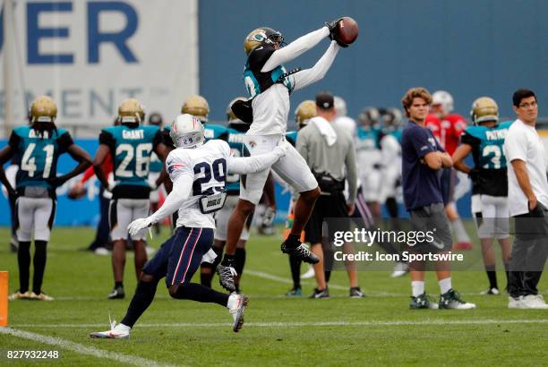 Jacksonville Jaguars wide receiver Rashad Greene Sr. Makes a grab over New England Patriots defensive back D.J. Killings during a joint New England...