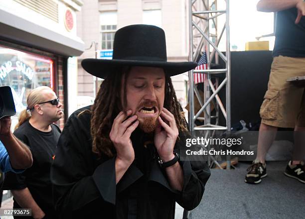 Competitive eater "Crazy Legs" Conti stretches out his jaws before the Annual Cannoli Eating Contest during the Feast of San Gennaro in Little Italy...