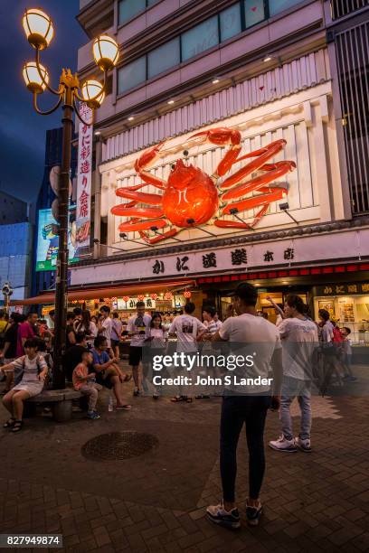 Dotombori Crab Restaurant - Dotonbori is a district of Osaka famous for its neon and mechanized signs, most famously for the sign of the candy...