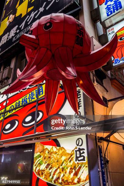 Dotombori Squid Takoyaki Restaurant - Dotonbori is a district of Osaka famous for its neon and mechanized signs, most famously for the sign of the...