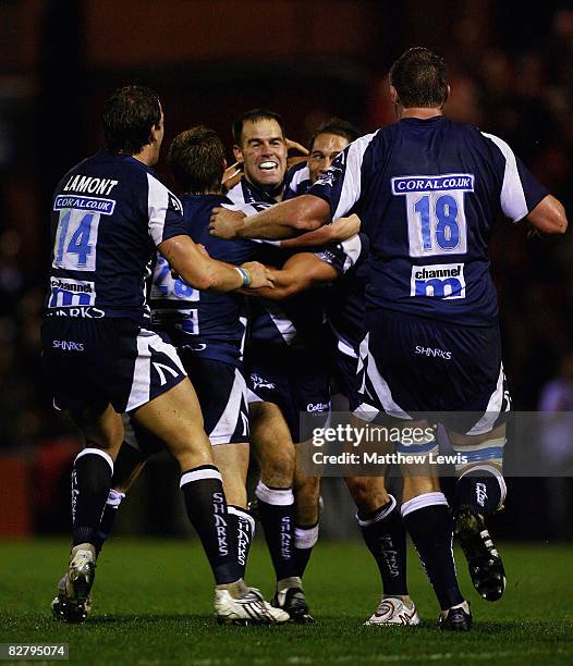 Charlie Hodgson of Sale is congratulated by team mates, after his drop goal won the game during the Guinness Premiership match between Sale Sharks...