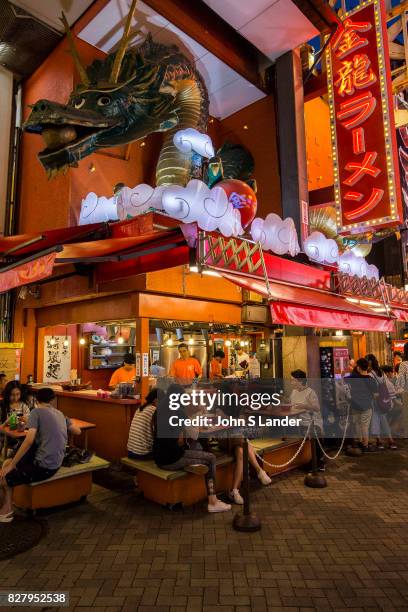 Dotombori Dragon -Dotonbori is a district of Osaka famous for its neon and mechanized signs, most famously for the sign of the candy manufacturer...