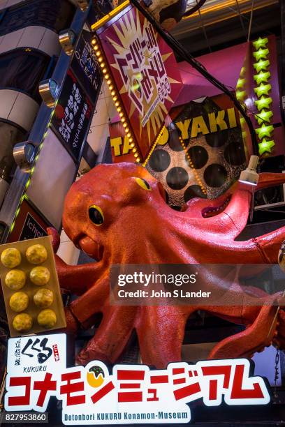 Dotombori Squid Takoyaki Restaurant - Dotonbori is a district of Osaka famous for its neon and mechanized signs, most famously for the sign of the...